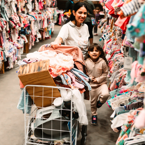 A family shops the JBF sale. 