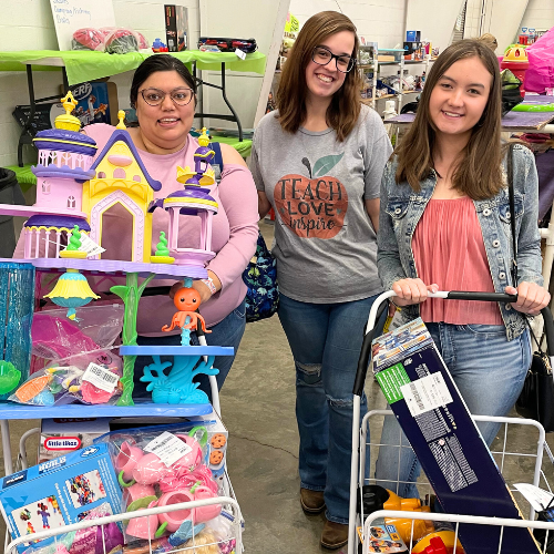 3 shoppers at a JBF sale. 