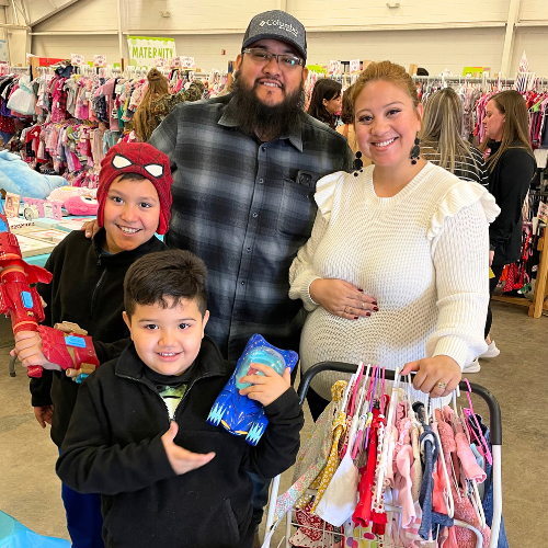 A family shops the JBF sale. 